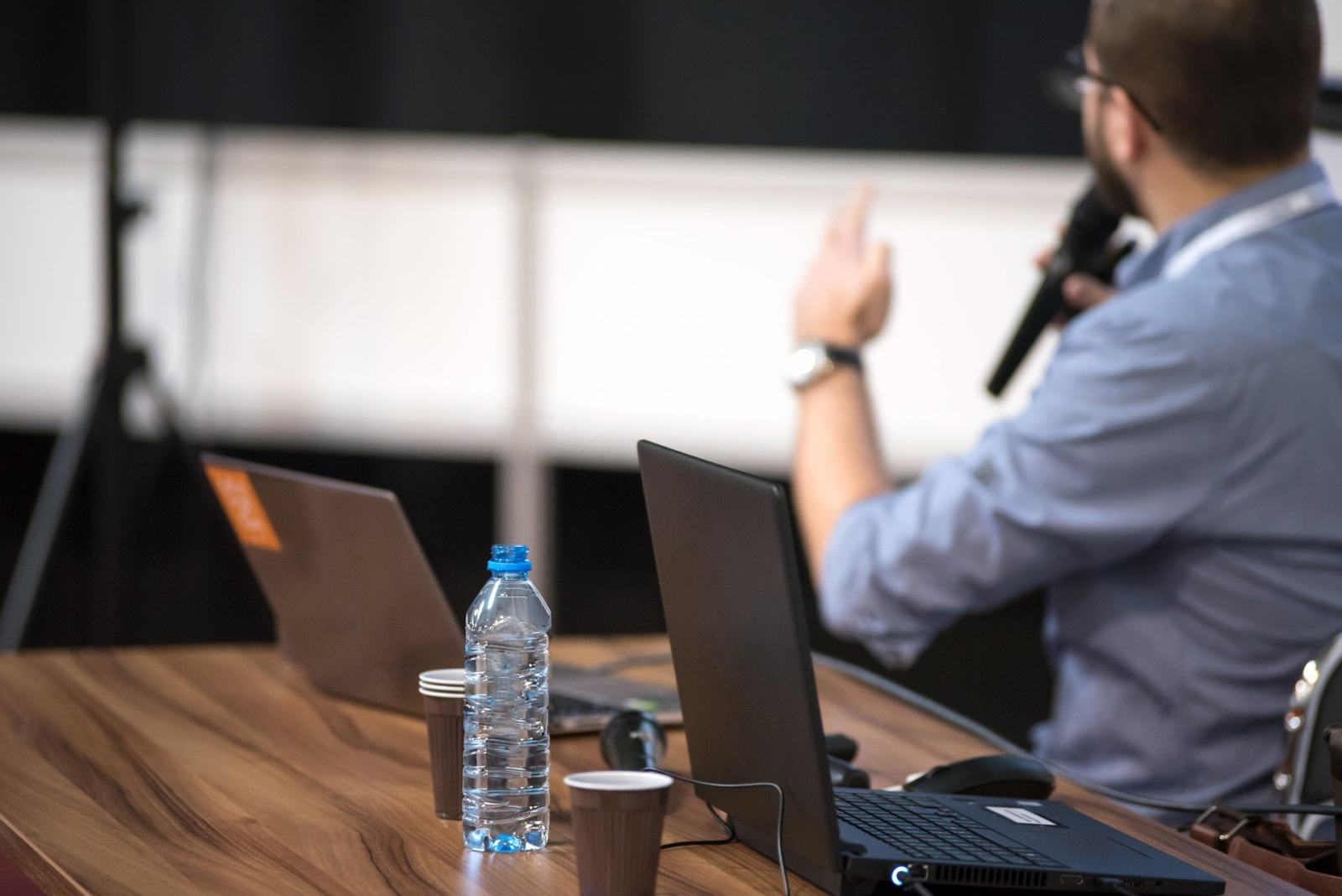 An audience listening to a speaker at a conference